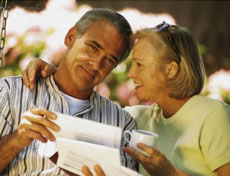 couple reading letter and smiling after receiving services from Solomon, Sullivan & Romo - Tallahassee disability lawyers